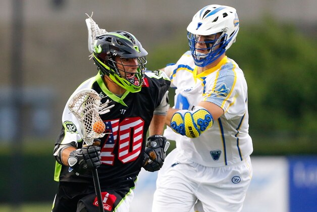 UNIONDALE, NY - JULY 03:  Steve DeNapoli #70 of the New York Lizards in action against Garrett Thul #9 of the Florida Launch during their Major League Lacrosse game at Shuart Stadium on July 3, 2014  in Uniondale, New York. The Lizards defeated the Launch 20-11.  (Photo by Jim McIsaac/Getty Images)