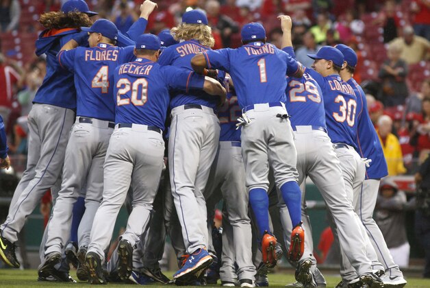 Sep 26, 2015; Cincinnati, OH, USA; National League East Champions the New York Mets celebrate on the field after their 10-2 win over the Cincinnati Reds at Great American Ball Park. Mandatory Credit: David Kohl-USA TODAY Sports