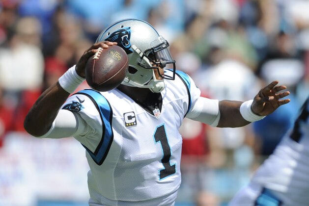 Carolina Panthers' Cam Newton (1) looks to pass against the Houston Texans during the first half of an NFL football game in Charlotte, N.C., Sunday, Sept. 20, 2015. (AP Photo/Mike McCarn)