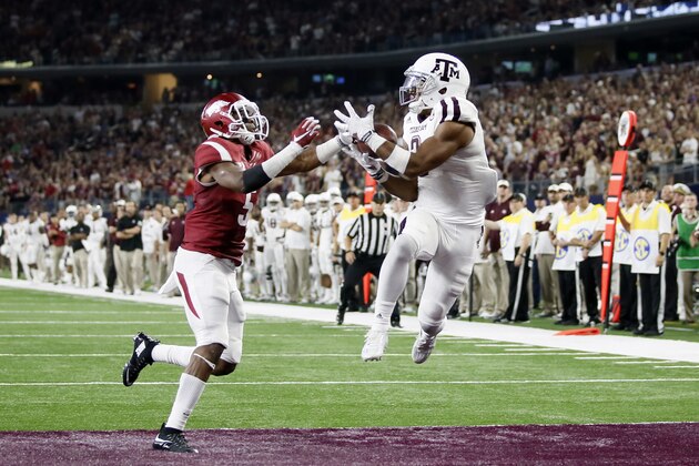 Texas A&M wide receiver Christian Kirk, right, pulls in a pass for a touchdown as Arkansas defensive back Henre' Toliver (5) reaches for the ball in overtime of an NCAA college football game on Saturday, Sept. 26, 2015, in Arlington, Texas. Texas A&M won 28-21. (AP Photo/Tony Gutierrez) Texas A&M wide receiver Christian Kirk, right, pulls in a pass for a touchdown as Arkansas defensive back Henre' Toliver (5) reaches for the ball in overtime of an NCAA college football game on Saturday, Sept. 26, 2015, in Arlington, Texas. Texas A&M won 28-21. (AP Photo/Tony Gutierrez)