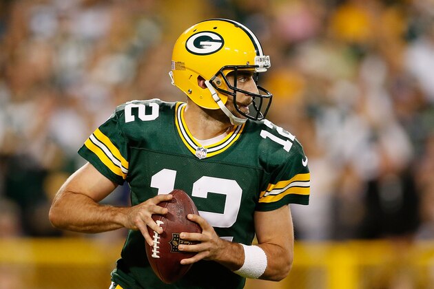 GREEN BAY, WI - SEPTEMBER 20:  Quarterback Aaron Rodgers #12 of the Green Bay Packers drops back to pass during the NFL game against the Seattle Seahawks at Lambeau Field on September 20, 2015 in Green Bay, Wisconsin. The Packers defeated the Seahawks 27-17.  (Photo by Christian Petersen/Getty Images)