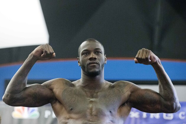 WBC heavyweight boxing champion Deontay Wilder weighs in, Friday, Sept. 25, 2015, in Birmingham, Ala. Wilder is preparing for a title defense, when he takes on Johann Duhaupas on Saturday, Sept. 26 in Birmingham. (AP Photo/Brynn Anderson)