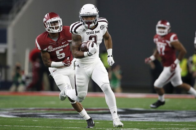 Texas A&M wide receiver Christian Kirk (3) sprints past Arkansas defensive back Henre' Toliver (5) as Kirk heads to the end zone for a score in the first half of an NCAA college football game on Saturday, Sept. 26, 2015, in Arlington, Texas. (AP Photo/Tony Gutierrez)