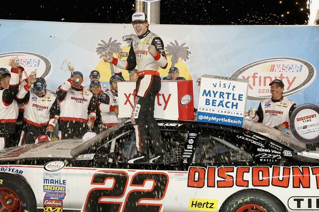 SPARTA, KY - SEPTEMBER 26:  Ryan Blaney, the driver of the #22 Discount Tire Ford celebrates in Victory Lane after winning the the NASCAR Xfinity Series VisitMyrtleBeach.com 300  at Kentucky Speedway on September 26, 2015 in Sparta, Kentucky.  (Photo by Andy Lyons/Getty Images)