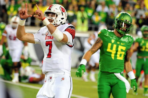 EUGENE, OR - SEPTEMBER 26: Quarterback Travis Wilson #7 of the Utah Utes celebrates a touchdown as linebacker Danny Mattingly #46 of the Oregon Ducks looks on in the third quarter against the Oregon Ducks at Autzen Stadium on September 26, 2015 in Eugene, Oregon.  (Photo by Steve Dykes/Getty Images)