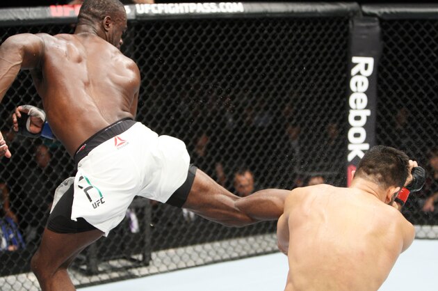 SAITAMA, JAPAN - SEPTEMBER 27: Uriah Hall of Jamaica lands a back kick to drop his opponent, Gegard Mousaasi of Iran in their middleweight bout during the UFC event at the Saitama Super Arena on September 27, 2015 in Saitama, Japan. (Photo by Mitch Viquez/Zuffa LLC/Zuffa LLC via Getty Images)