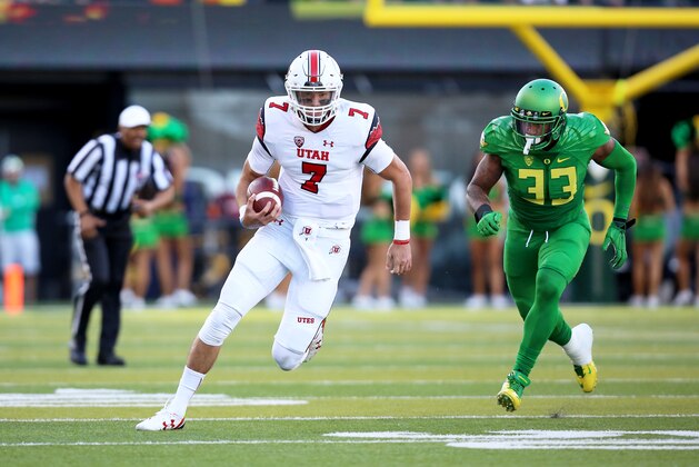 Utah quarterback Travis Wilson (7) runs with the football during the first half of an NCAA college football game against Oregon, Saturday, Sept. 26, 2015, in Eugene, Ore. (AP Photo/Ryan Kang)