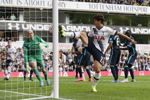 Off-side is given against Tottenham Hotspur's Son Heung-min, center, as he scores a disallowed goal during the English Premier League soccer match between Tottenham Hotspur and Manchester City at White Hart Lane stadium in London, Saturday, Sept. 26, 2015.  (AP Photo/Matt Dunham)