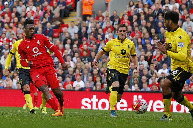 Liverpool's English striker Daniel Sturridge (2nd L) scores his team's third goal during the English Premier League football match between Liverpool and Aston Villa at the Anfield stadium in Liverpool, north-west England on September 26, 2015. AFP PHOTO / LINDSEY PARNABY

RESTRICTED TO EDITORIAL USE. No use with unauthorized audio, video, data, fixture lists, club/league logos or 'live' services. Online in-match use limited to 75 images, no video emulation. No use in betting, games or single club/league/player publications.        (Photo credit should read LINDSEY PARNABY/AFP/Getty Images)