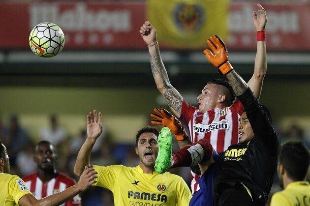 Atletico Madrid's Uruguayan defender Jose Maria Gimenez (L) vies with  Villarreal's French goalkeeper Alphonse Areola during the Spanish league football match Villarreal CF vs Club Atletico de Madrid at El Madrigal stadium in Villareal on September 26, 2015.  AFP PHOTO / JOSE JORDAN        (Photo credit should read JOSE JORDAN/AFP/Getty Images)