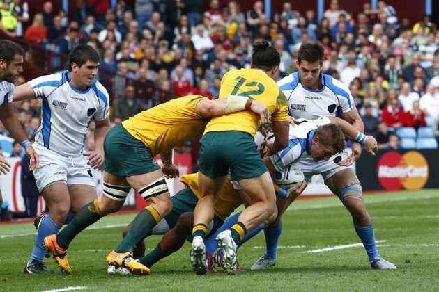 Uruguay's Leandro Leivas tries to charge through during the Rugby World Cup Pool A match between Australia and Uruguay at Villa Park, Birmingham, England, Sunday, Sept. 27, 2015. (AP Photo/Martin Cleaver)