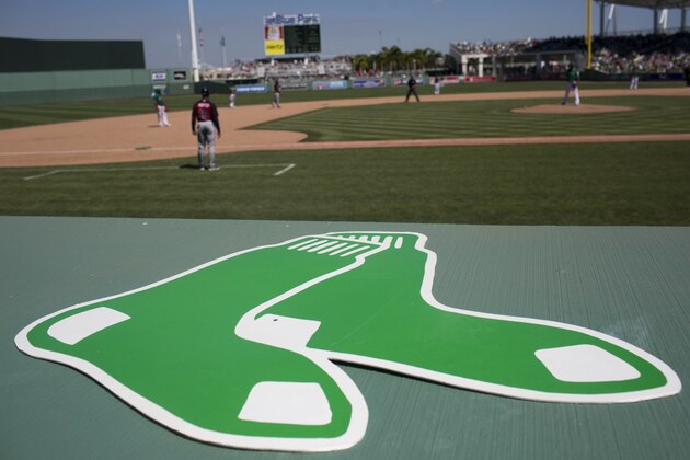 In the spirit of St. Patrick's Day, the Boston Red Sox' wore green and a green sox logo instead of a red one during an exhibition spring training baseball game against Atlanta, Tuesday, March 17, 2015, in Fort Myers, Fla.  Braves won 11-3. (AP Photo/Brynn Anderson)