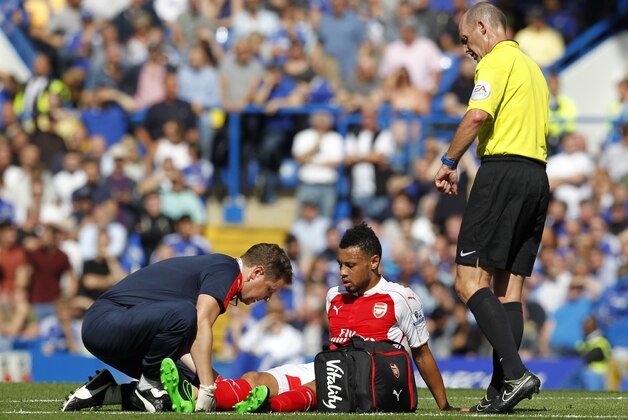 Arsenal's French midfielder Francis Coquelin receives treatment during the English Premier League football match between Chelsea and Arsenal at Stamford Bridge in London on September 19, 2015. AFP PHOTO / IAN KINGTON 

RESTRICTED TO EDITORIAL USE. No use with unauthorized audio, video, data, fixture lists, club/league logos or 'live' services. Online in-match use limited to 75 images, no video emulation. No use in betting, games or single club/league/player publications.        (Photo credit should read IAN KINGTON/AFP/Getty Images)