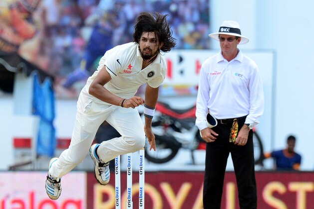Indian cricketer Ishant Sharma (L) leaps into the air after delivers the ball during the final day of the second Test cricket match between Sri Lanka and India at the P. Sara Oval Cricket Stadium in Colombo on August 24, 2015. AFP PHOTO / LAKRUWAN WANNIARACHCHI        (Photo credit should read LAKRUWAN WANNIARACHCHI/AFP/Getty Images)