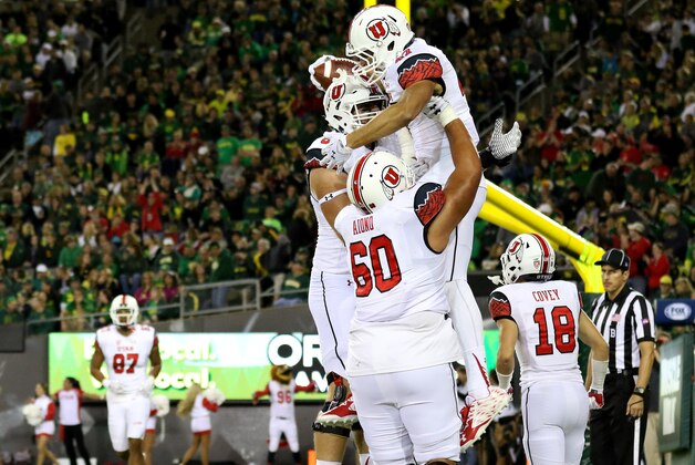 Utah tight end Caleb Repp (47) celebrates with teammates after scoring a touchdown during the second half of an NCAA college football game against Oregon, Saturday, Sept. 26, 2015, in Eugene, Ore. (AP Photo/Ryan Kang)