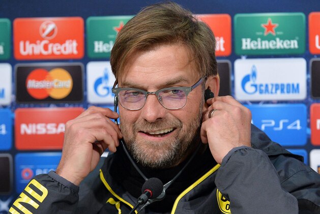Borussia Dortmund coach Jurgen Klopp listens to a question during a press conference at the Juventus Stadium in Turin, Italy, Monday, Feb. 23, 2015. Juventus will play Borussia Dortmund Tuesday in a Champions League round of 16 soccer match. (AP Photo/Alessandro Di Marco, Ansa) ITALY OUT