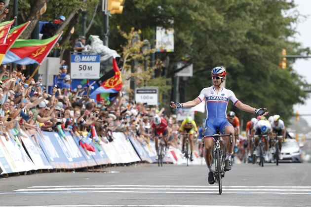 Peter Sagan, of Slovakia, crosses the finish line to win the UCI Elite Men's Road World Championship Cycling race in Richmond, Va., Sunday, Sept. 27, 2015. (AP Photo/Steve Helber) Peter Sagan, of Slovakia, crosses the finish line to win the UCI Elite Men's Road World Championship Cycling race in Richmond, Va., Sunday, Sept. 27, 2015. (AP Photo/Steve Helber)