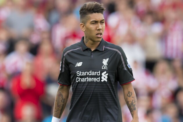 Liverpool's Roberto Firmino stands during the English Premier League soccer match between Stoke and Liverpool at the Britannia Stadium, Stoke, England, Sunday Aug. 9, 2015. (AP Photo/Jon Super)