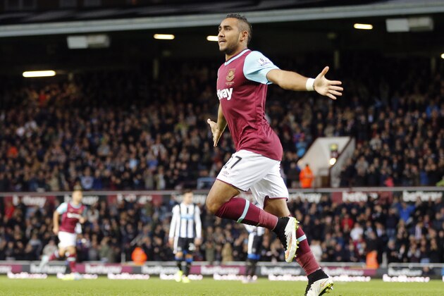 West Ham’s Dimitri Payet celebrates after scoring during the English Premier League soccer match between West Ham and Newcastle at Boleyn Ground in London, Monday, Sept. 14, 2015.(AP Photo/Frank Augstein)