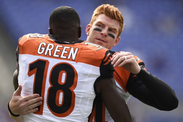 Cincinnati Bengals quarterback Andy Dalton (14) greets teammate wide receiver A.J. Green (18) before an NFL football game against the Baltimore Ravens in Baltimore, Sunday, Sept. 27, 2015. (AP Photo/Gail Burton)