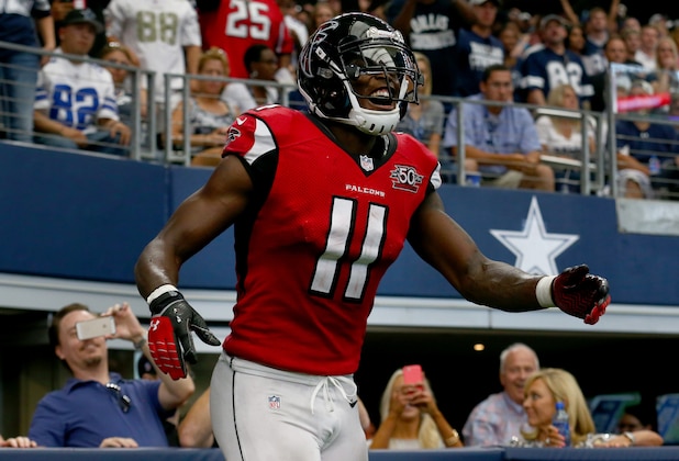 ARLINGTON, TX - SEPTEMBER 27: Julio Jones #11 of the Atlanta Falcons smiles after scoring on a touchdown pass against the Dallas Cowboys in the fourth quarter at AT&T Stadium on September 27, 2015 in Arlington, Texas. (Photo by Tom Pennington/Getty Images)