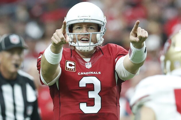 Arizona Cardinals quarterback Carson Palmer (3) calls a play against the San Francisco 49ers during the first half of an NFL football game, Sunday, Sept. 27, 2015, in Glendale, Ariz.  (AP Photo/Rick Scuteri)