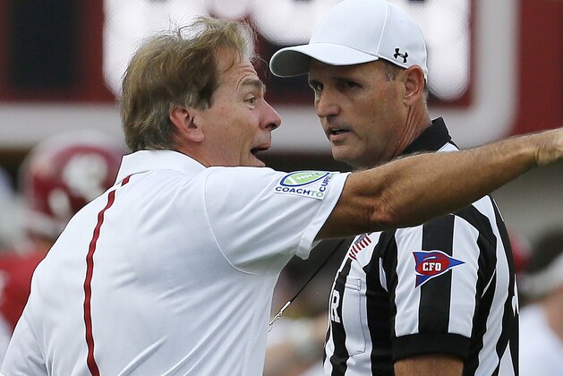 Alabama head coach Nick Saban talks to an official during the first half of an NCAA college football game in Tuscaloosa, Ala., Saturday, Sept. 26, 2015. (AP Photo/Jonathan Bachman)