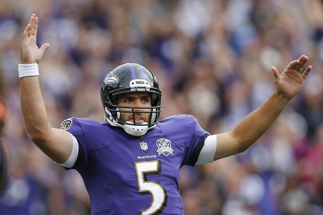 Baltimore Ravens quarterback Joe Flacco (5) throws his arms up after wide receiver Steve Smith scores during the second half of an NFL football game against the Cincinnati Bengals in Baltimore, Sunday, Sept. 27, 2015. (AP Photo/Patrick Semansky)