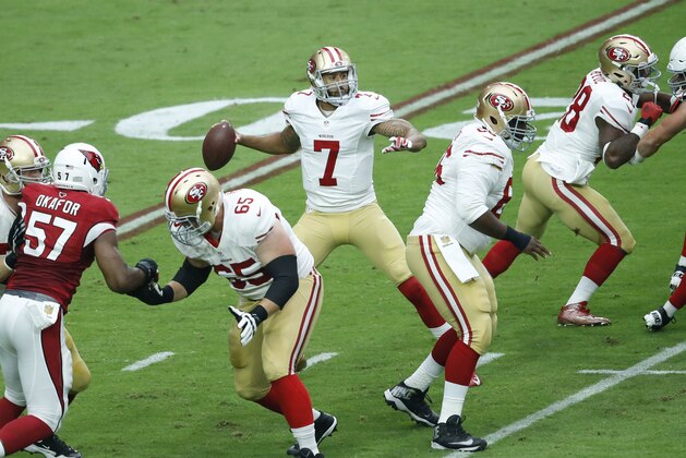 San Francisco 49ers quarterback Colin Kaepernick (7) looks to throw against the Arizona Cardinals during the first half of an NFL football game, Sunday, Sept. 27, 2015, in Glendale, Ariz.  (AP Photo/Rick Scuteri)