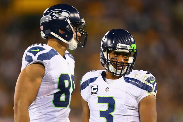 GREEN BAY, WI - SEPTEMBER 20:   Russell Wilson #3 of the Seattle Seahawks talks with  Jimmy Graham #88 during the game against the Green Bay Packers at Lambeau Field on September 20, 2015 in Green Bay, Wisconsin.  (Photo by Maddie Meyer/Getty Images)