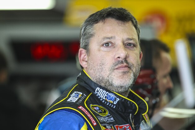 Driver Tony Stewart waits in the garage while his car is worked on during practice for the Sunday's NASCAR Sprint Cup series auto race at New Hampshire Motor Speedway in Loudon, N.H., Friday, Sept. 25, 2015  (AP Photo/Cheryl Senter)