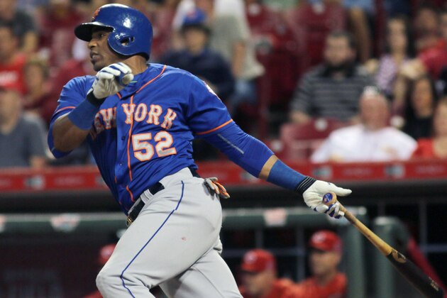 New York Mets Yoenis Cespedes hits an RBI single against the Cincinnati Reds in the seventh inning of a baseball game in Cincinnati, Thursday, Sept. 24, 2015. (AP Photo/Tom Uhlman)