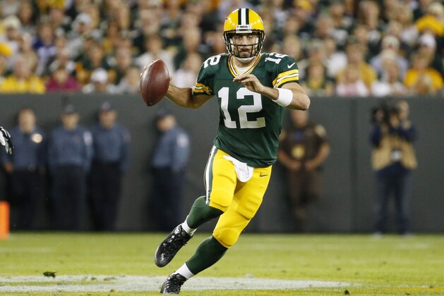 Green Bay Packers' Aaron Rodgers runs during the first half of an NFL football game against the Seattle Seahawks Sunday, Sept. 20, 2015, in Green Bay, Wis. (AP Photo/Mike Roemer)