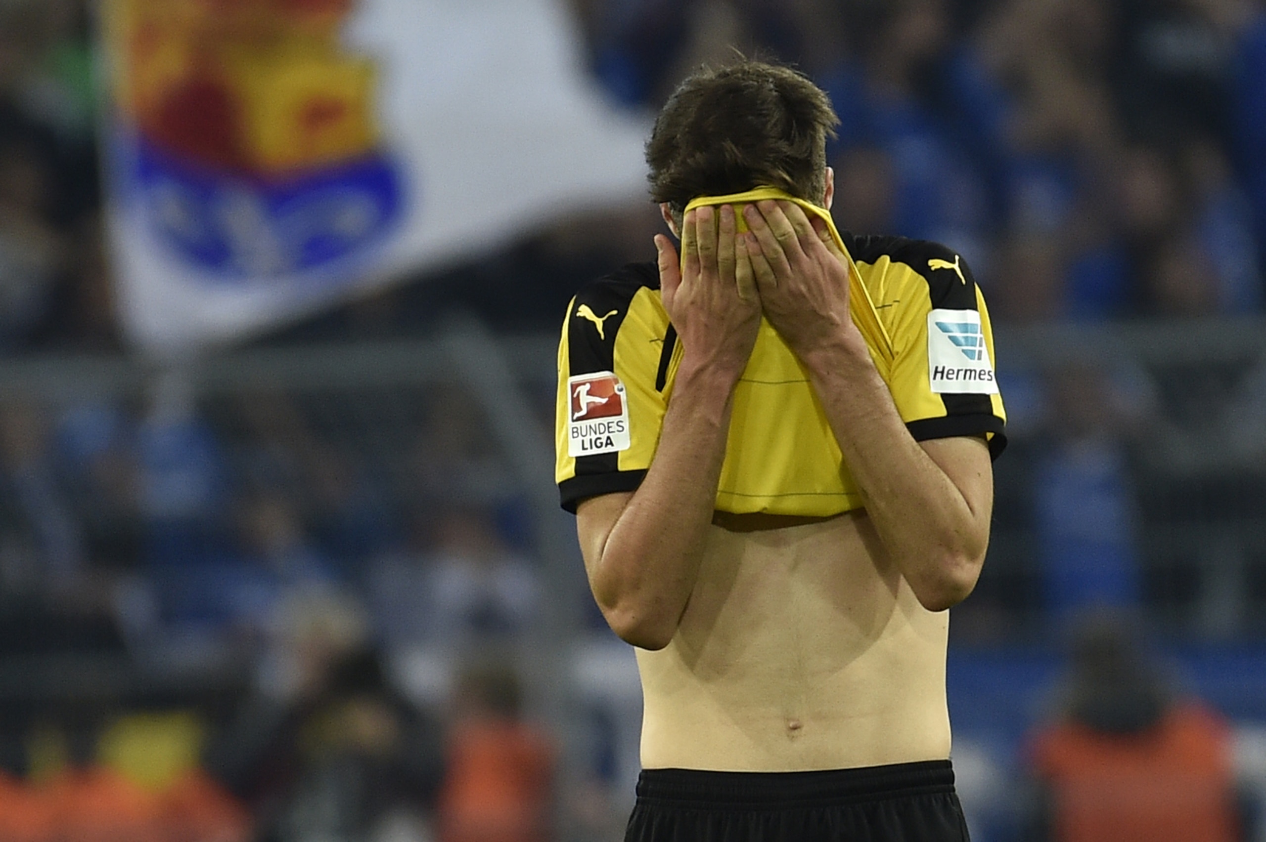Dortmund's Julian Weigl stands on the pitch disappointed after the German Bundesliga soccer match between Borussia Dortmund and SV Darmstadt in Dortmund, Germany, Sunday, Sept. 27, 2015. The match ended 2-2. (AP Photo/Martin Meissner)