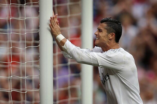 Real Madrid's Cristiano Ronaldo reacts during a La Liga soccer match between Real Madrid and Malaga at the Santiago Bernabeu stadium in Madrid, Spain, Saturday, Sept. 26, 2015. (AP Photo/Daniel Ochoa de Olza)