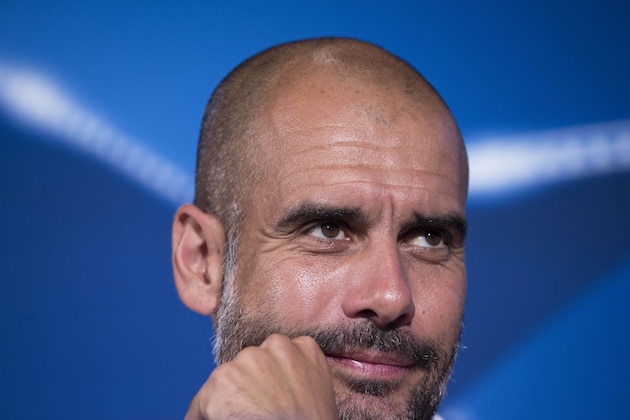 Bayern's head coach Pep Guardiola listens to question during a news conference in Athens, Tuesday, Sept. 15, 2015. Bayern Munich will play against Olympiakos on Wednesday in a Champions League Group F soccer match. (AP Photo/Petros Giannakouris)