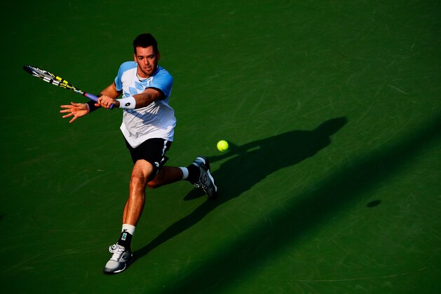 NEW YORK, NY - SEPTEMBER 03:  Austin Krajicek of the United States returns a shot against Kevin Anderson of South Africa during their Men's Singles Second Round match against on Day Four of the 2015 US Open at the USTA Billie Jean King National Tennis Center on September 3, 2015 in the Flushing neighborhood of the Queens borough of New York City.  (Photo by Alex Goodlett/Getty Images)