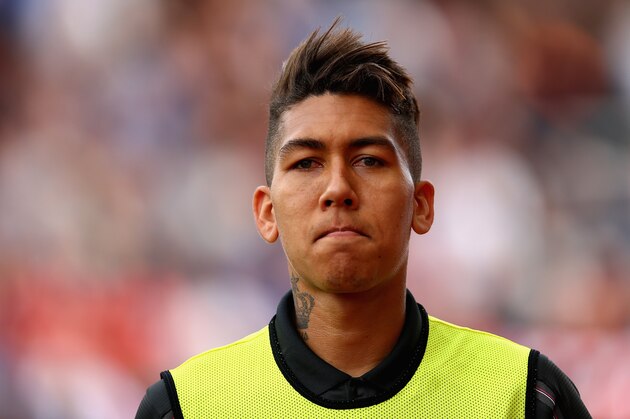 STOKE ON TRENT, ENGLAND - AUGUST 09:  Roberto Firmino of Liverpool starts on the substitutes bench during the Barclays Premier League match between Stoke City and Liverpool at Britannia Stadium on August 9, 2015 in Stoke on Trent, England.  (Photo by Clive Brunskill/Getty Images)