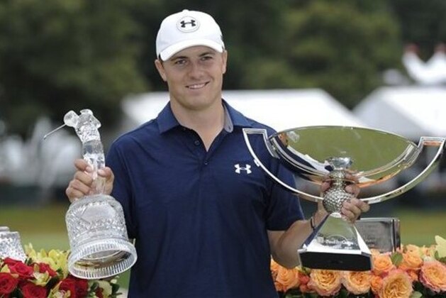 CORRECTS SPELLING TO SPIETH, INSTEAD OF SPEITH - Jordan Spieth poses with the trophies after winning the Tour Championship golf tournament and the FedEx Cup at East Lake Golf Club on Sunday, Sept. 27, 2015, in Atlanta. (AP Photo/John Amis)