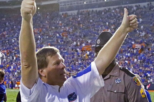 Florida head coach Jim McElwain gives the thumbs up to fans after defeating Tennessee 28-27 in an NCAA college football game, Saturday, Sept. 26, 2015, in Gainesville, Fla. Florida won 28-27. (AP Photo/John Raoux)