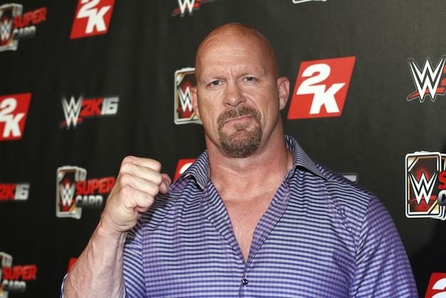 IMAGE DISTRIBUTED FOR 2K - WWE Hall of Famer and WWE 2K16 cover, Superstar Stone Cold Steve Austin arrives on the red carpet at the WWE 2K SummerSlam Kickoff in New York, N.Y., on Thursday, Aug. 20, 2015. (Photo by Stuart Ramson/Invision for 2K/AP Images)
