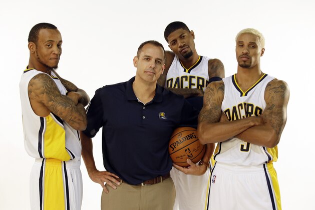 Indiana Pacers head coach Frank Vogel poses with Monta Ellis, left, Paul George and George Hill, right, during the team's NBA basketball media day, Monday, Sept. 28, 2015 in Indianapolis. (AP Photo/Darron Cummings)