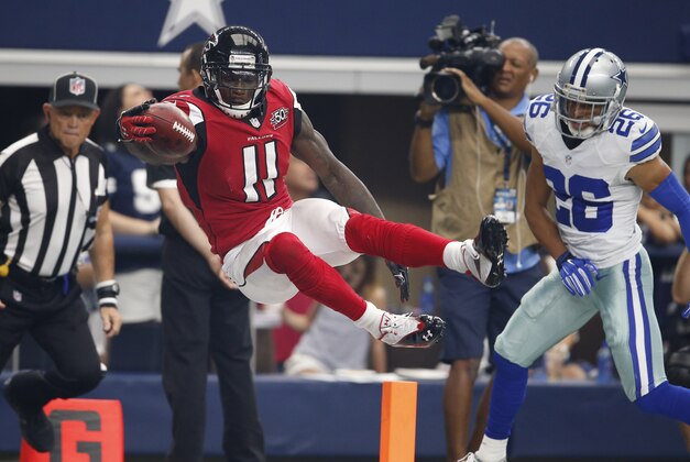 Sep 27, 2015; Arlington, TX, USA; Atlanta Falcons receiver Julio Jones (11) dives for the pylon to score a touchdown in the third quarter against Dallas Cowboys cornerback Tyler Patmon (26) at AT&T Stadium. Mandatory Credit: Matthew Emmons-USA TODAY Sports