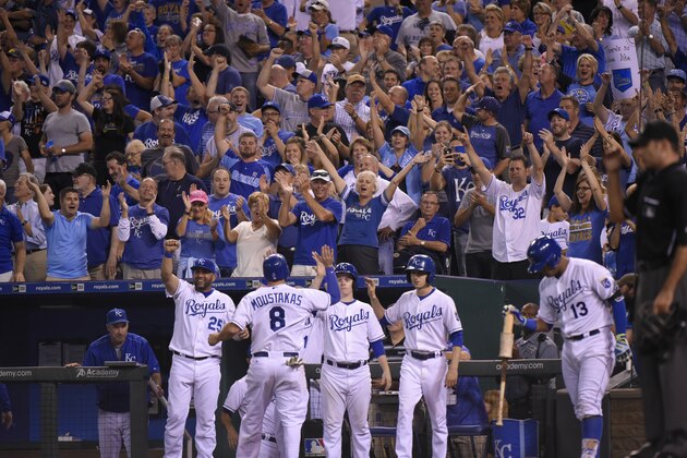KANSAS CITY, MO - SEPTEMBER 24:  Fans cheer after Mike Moustakas #8 of the Kansas City Royals scored on a Alex Rios triple in the eighth inning against the Seattle Mariners at Kauffman Stadium on September 24, 2015 in Kansas City, Missouri. (Photo by Ed Zurga/Getty Images)