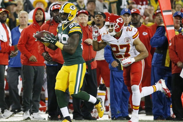 Green Bay Packers' James Jones catches a pass in front of Kansas City Chiefs' Tyvon Branch during the first half of an NFL football game Monday, Sept. 28, 2015, in Green Bay, Wis. (AP Photo/Mike Roemer)