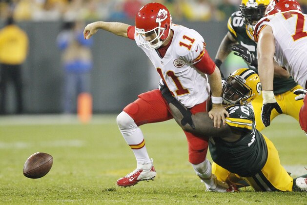 Kansas City Chiefs' Alex Smith (11) fumbles as he is sacked by Green Bay Packers' Mike Daniels during the second half of an NFL football game Monday, Sept. 28, 2015, in Green Bay, Wis. The Chiefs recovered the fumble. (AP Photo/Matt Ludtke)