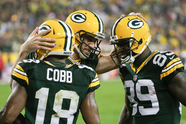 GREEN BAY, WI - SEPTEMBER 28:  Quarterback  Aaron Rodgers #12 of the Green Bay Packers celebrates with  Randall Cobb #18 and  James Jones #89 after scoring against the Kansas City Chiefs in the third quarter at Lambeau Field on September 28, 2015 in Green Bay, Wisconsin.  (Photo by Jonathan Daniel/Getty Images)
