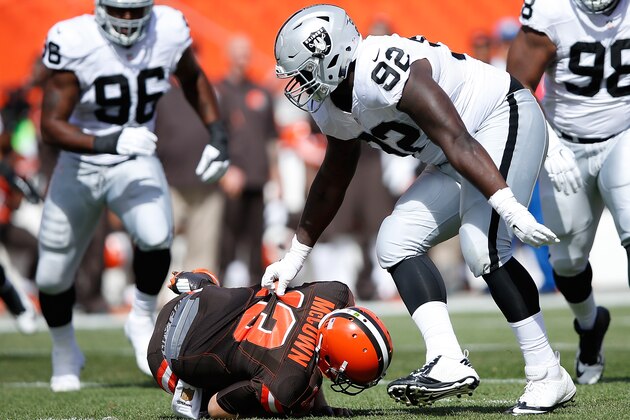 CLEVELAND, OH - SEPTEMBER 27:  Stacy McGee #92 of the Oakland Raiders sacks Josh McCown #13 of the Cleveland Browns during the first quarter at FirstEnergy Stadium on September 27, 2015 in Cleveland, Ohio.  (Photo by Joe Robbins/Getty Images)