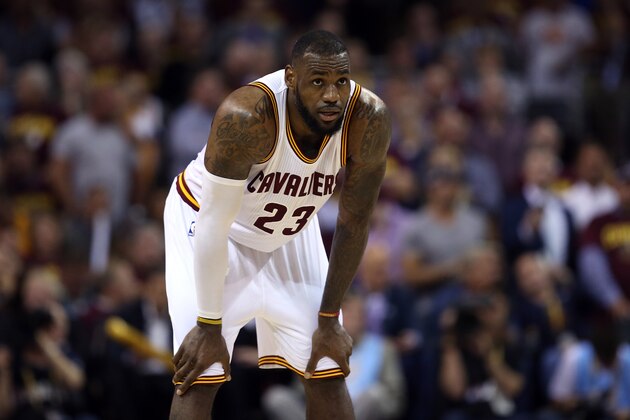 CLEVELAND, OH - JUNE 16:  LeBron James #23 of the Cleveland Cavaliers reacts against the Golden State Warriors during Game Six of the 2015 NBA Finals at Quicken Loans Arena on June 16, 2015 in Cleveland, Ohio. NOTE TO USER: User expressly acknowledges and agrees that, by downloading and or using this photograph, user is consenting to the terms and conditions of Getty Images License Agreement.  (Photo by Ezra Shaw/Getty Images)