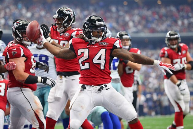 ARLINGTON, TX - SEPTEMBER 27:  Devonta Freeman #24 of the Atlanta Falcons spikes the ball after scoring a touchdown against the Dallas Cowboys in the second quarter at AT&T Stadium on September 27, 2015 in Arlington, Texas.  (Photo by Ronald Martinez/Getty Images)